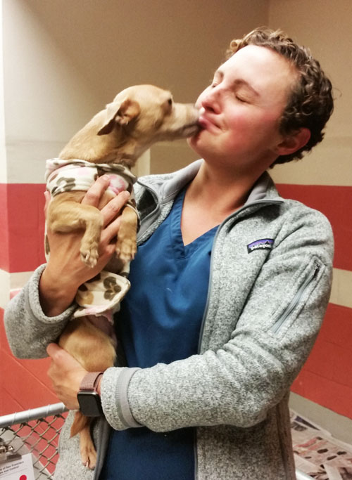 woman holding dog